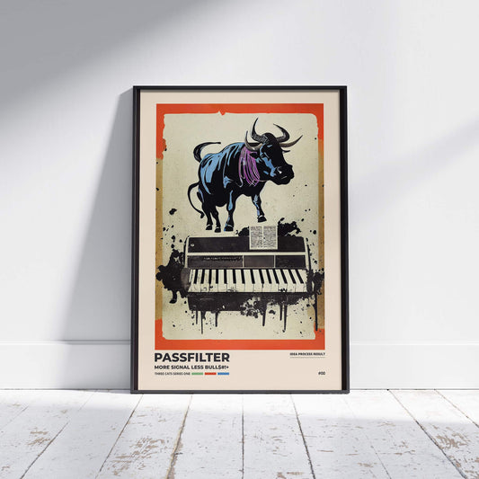 Black framed Passfilter poster sitting on a white wooden floor in a recording studio.