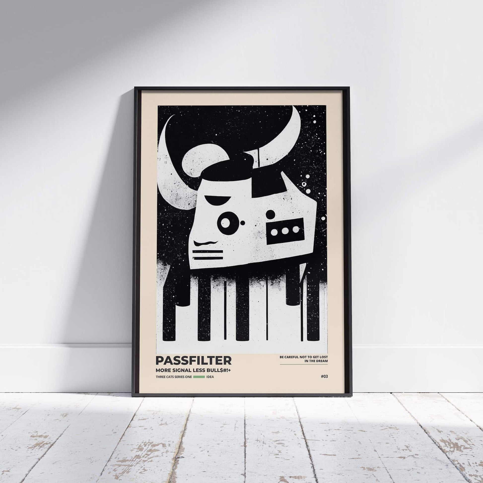 Black framed Passfilter poster sitting on a white wooden floor in a recording studio.