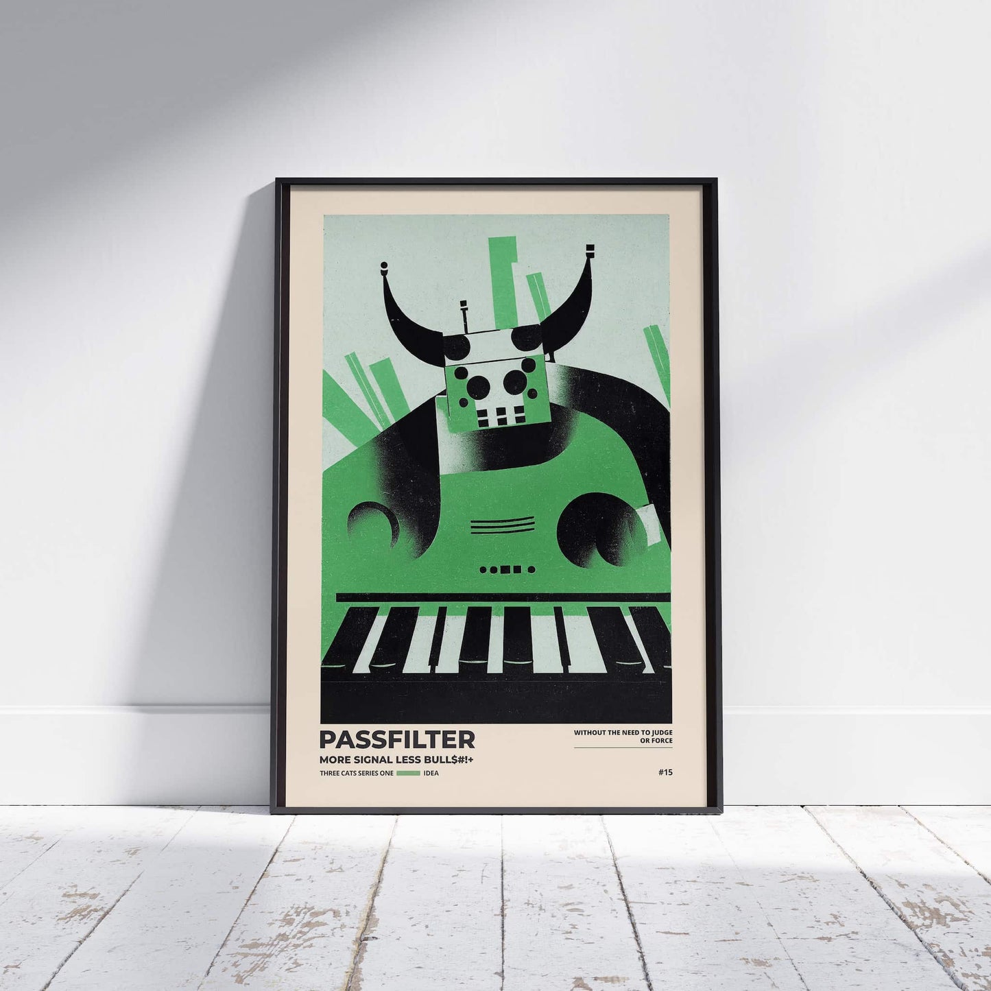 Black framed Passfilter poster sitting on a white wooden floor in a recording studio.
