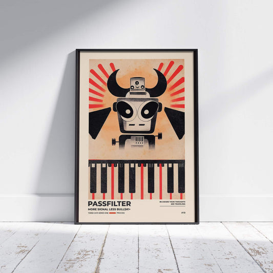 Black framed Passfilter poster sitting on a white wooden floor in a recording studio.