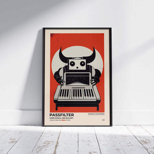 Black framed Passfilter poster sitting on a white wooden floor in a recording studio.