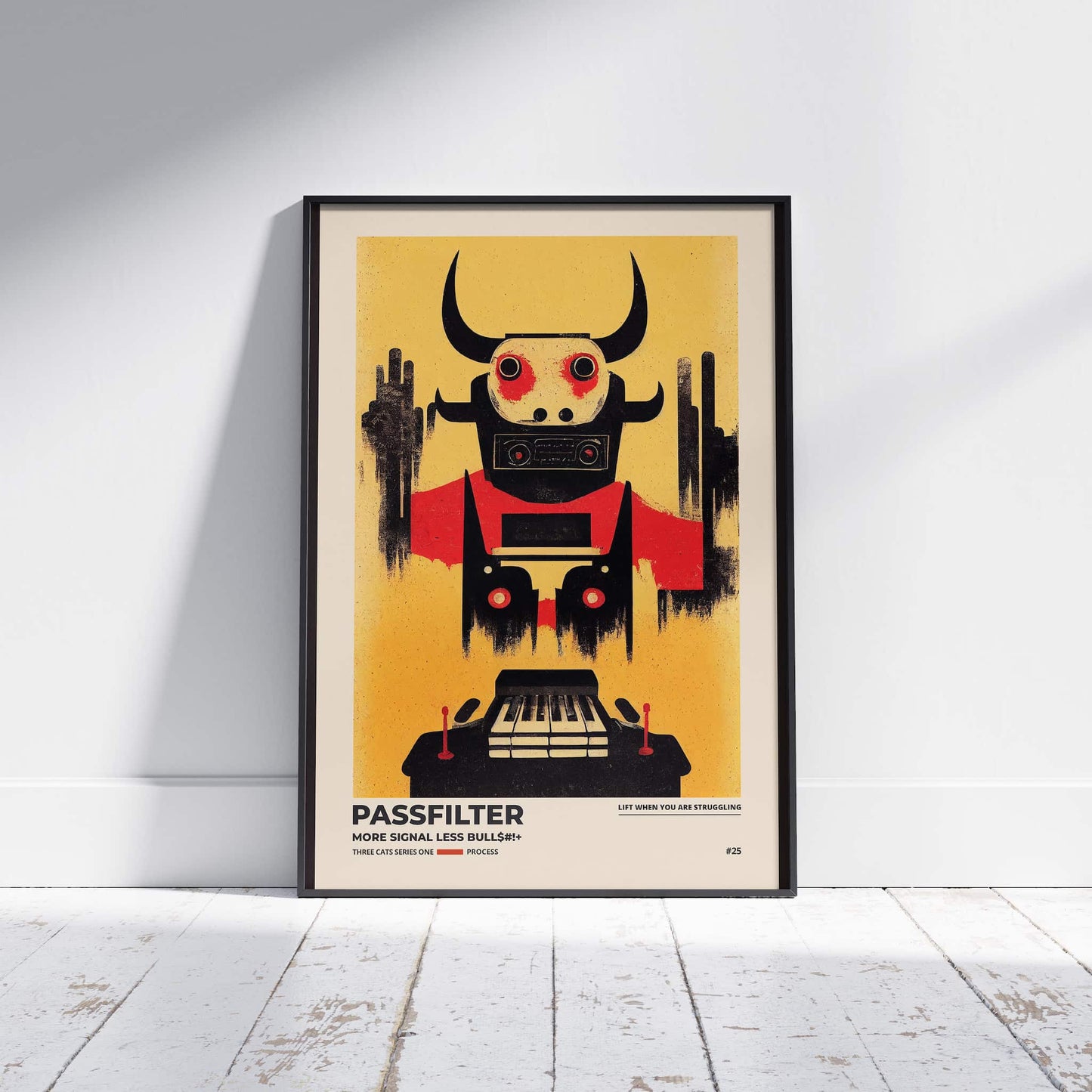 Black framed Passfilter poster sitting on a white wooden floor in a recording studio.