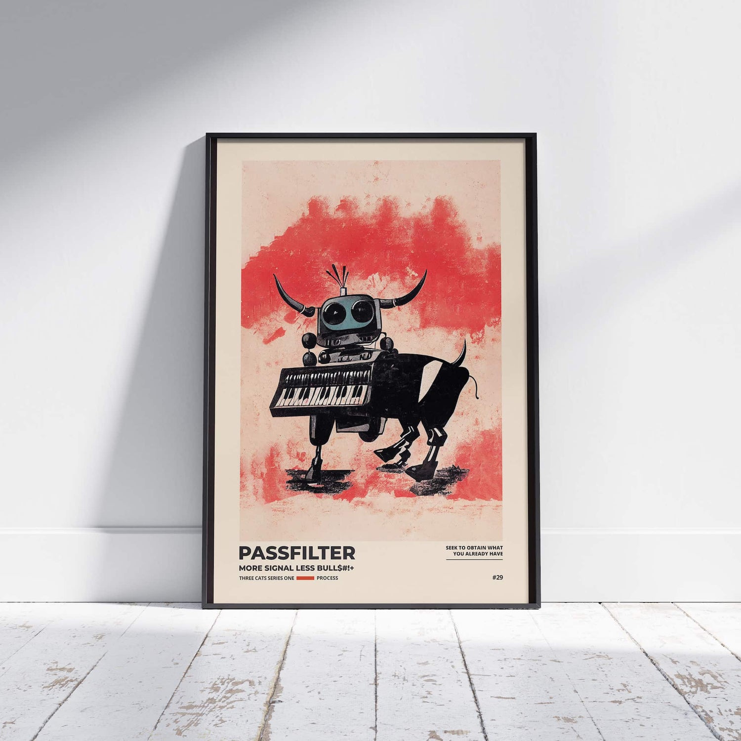 Black framed Passfilter poster sitting on a white wooden floor in a recording studio.