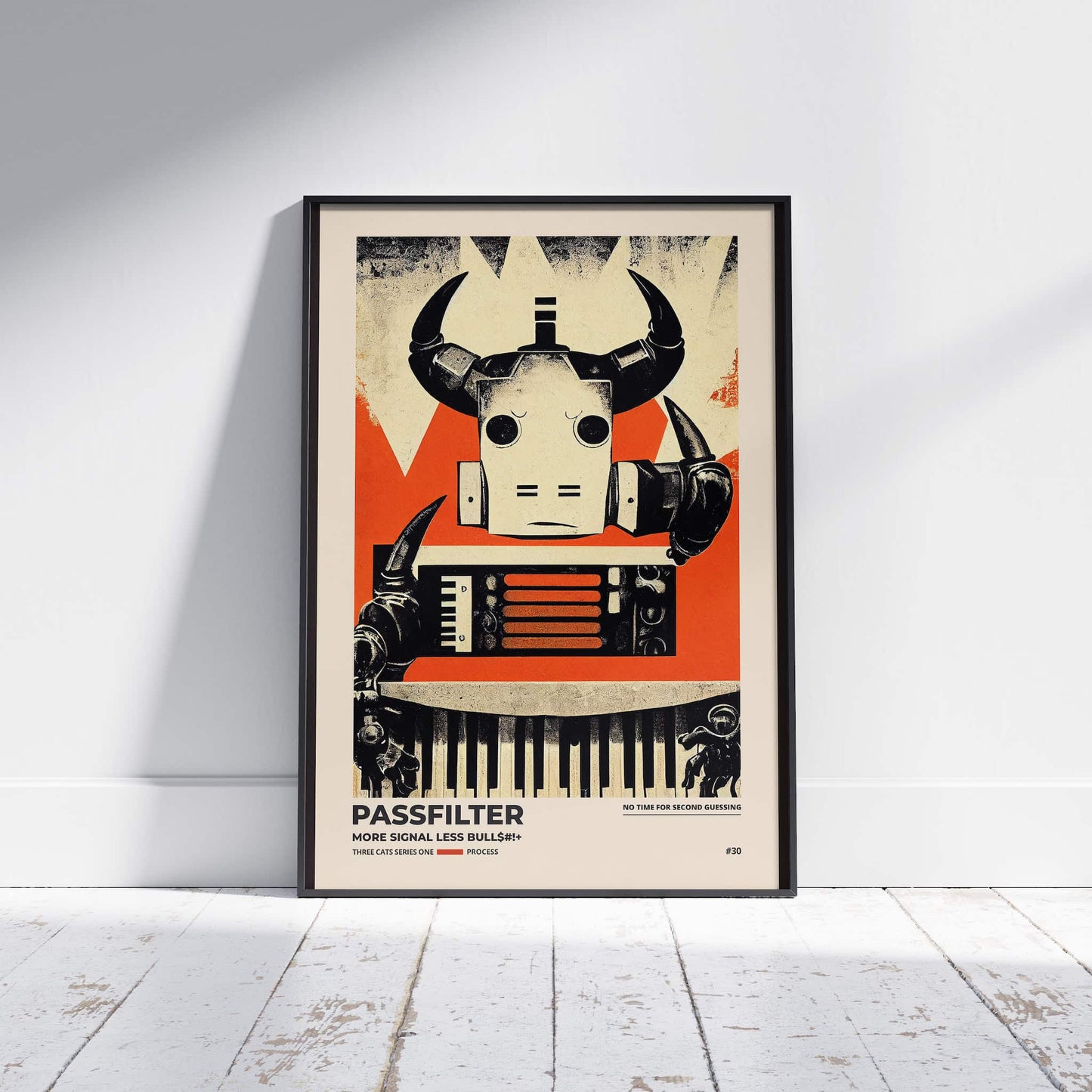 Black framed Passfilter poster sitting on a white wooden floor in a recording studio.