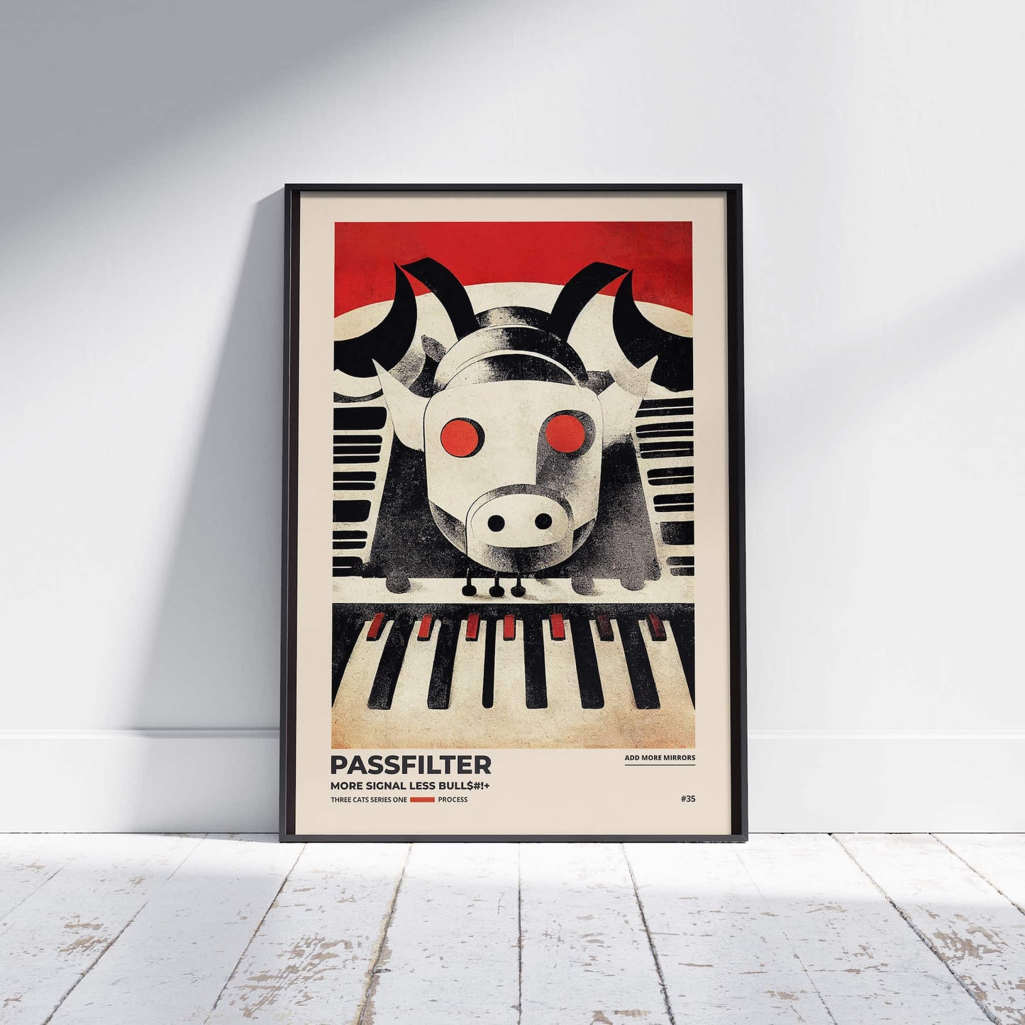 Black framed Passfilter poster sitting on a white wooden floor in a recording studio.