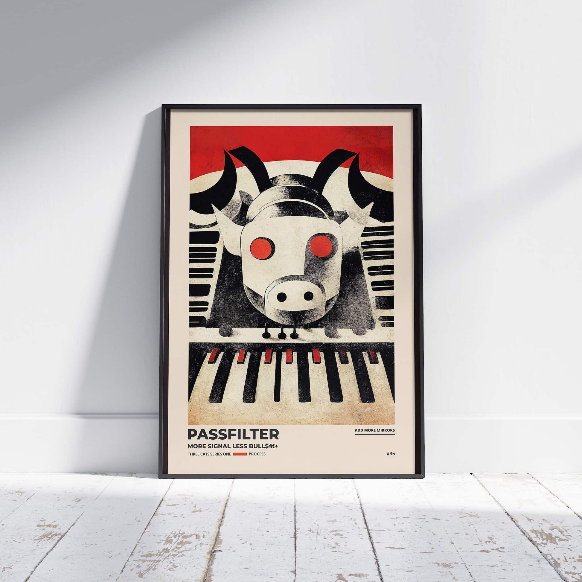 Black framed Passfilter poster sitting on a white wooden floor in a recording studio.