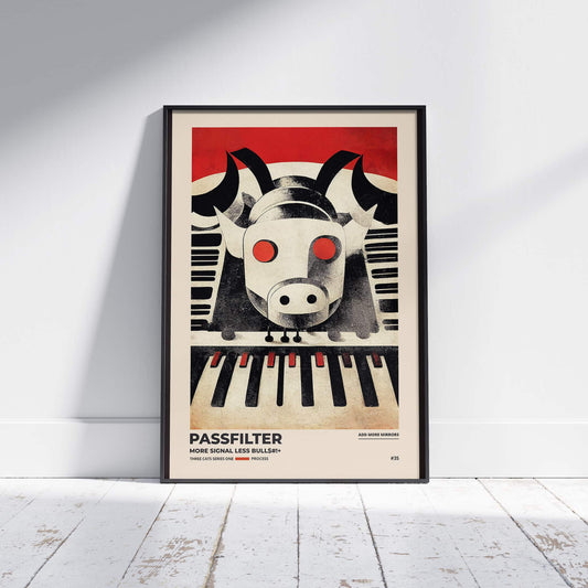 Black framed Passfilter poster sitting on a white wooden floor in a recording studio.