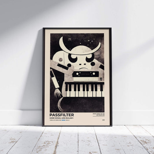 Black framed Passfilter poster sitting on a white wooden floor in a recording studio.