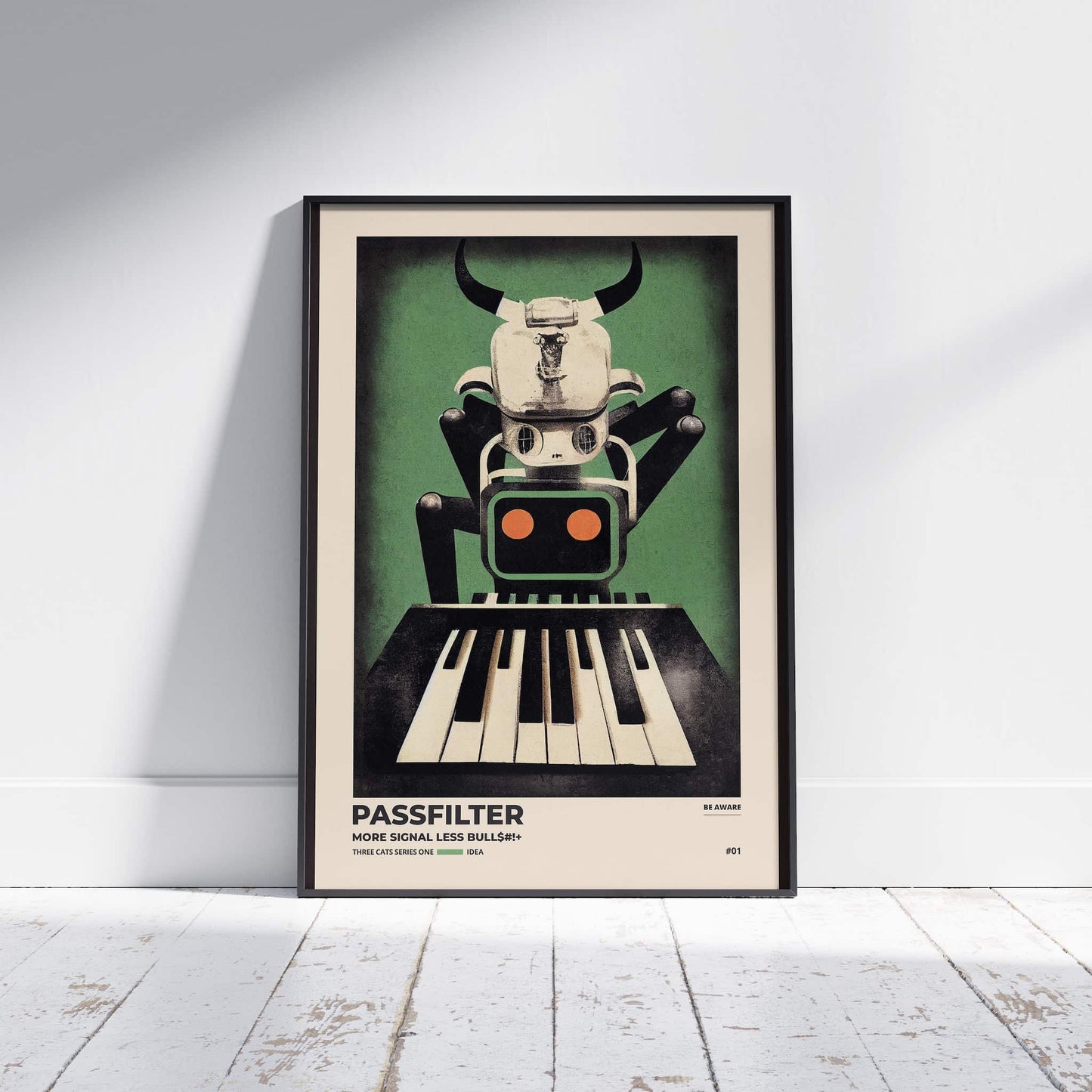 Black framed Passfilter poster sitting on a white wooden floor in a recording studio.