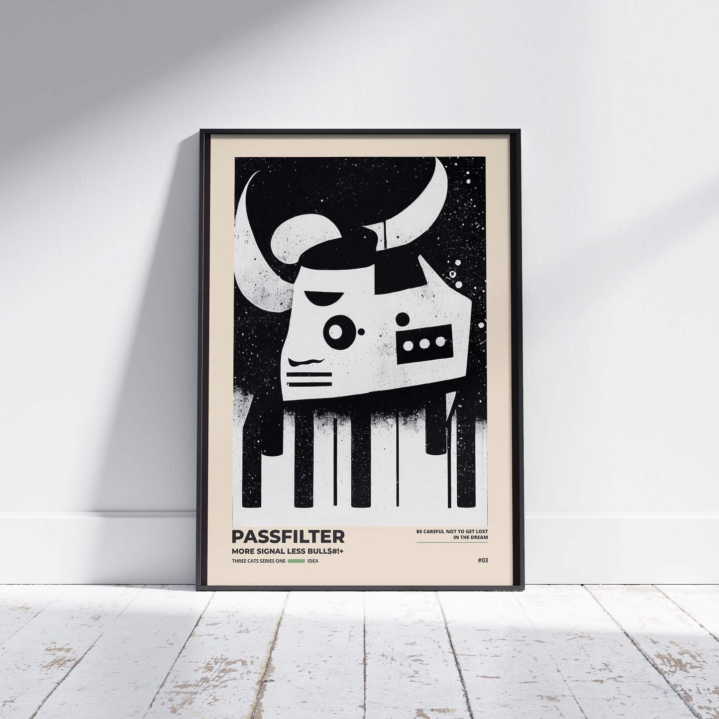 Black framed Passfilter poster sitting on a white wooden floor in a recording studio.