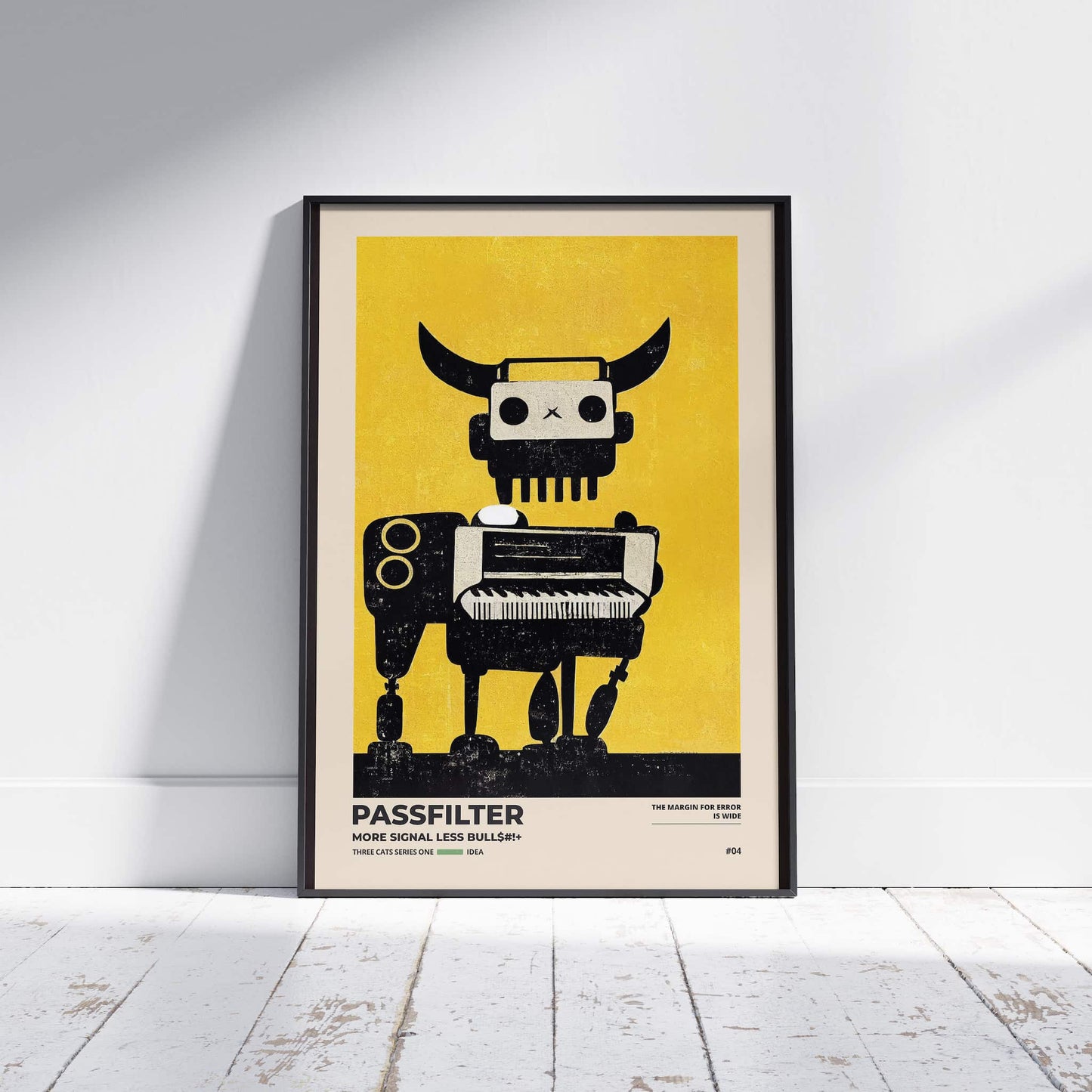 Black framed Passfilter poster sitting on a white wooden floor in a recording studio.