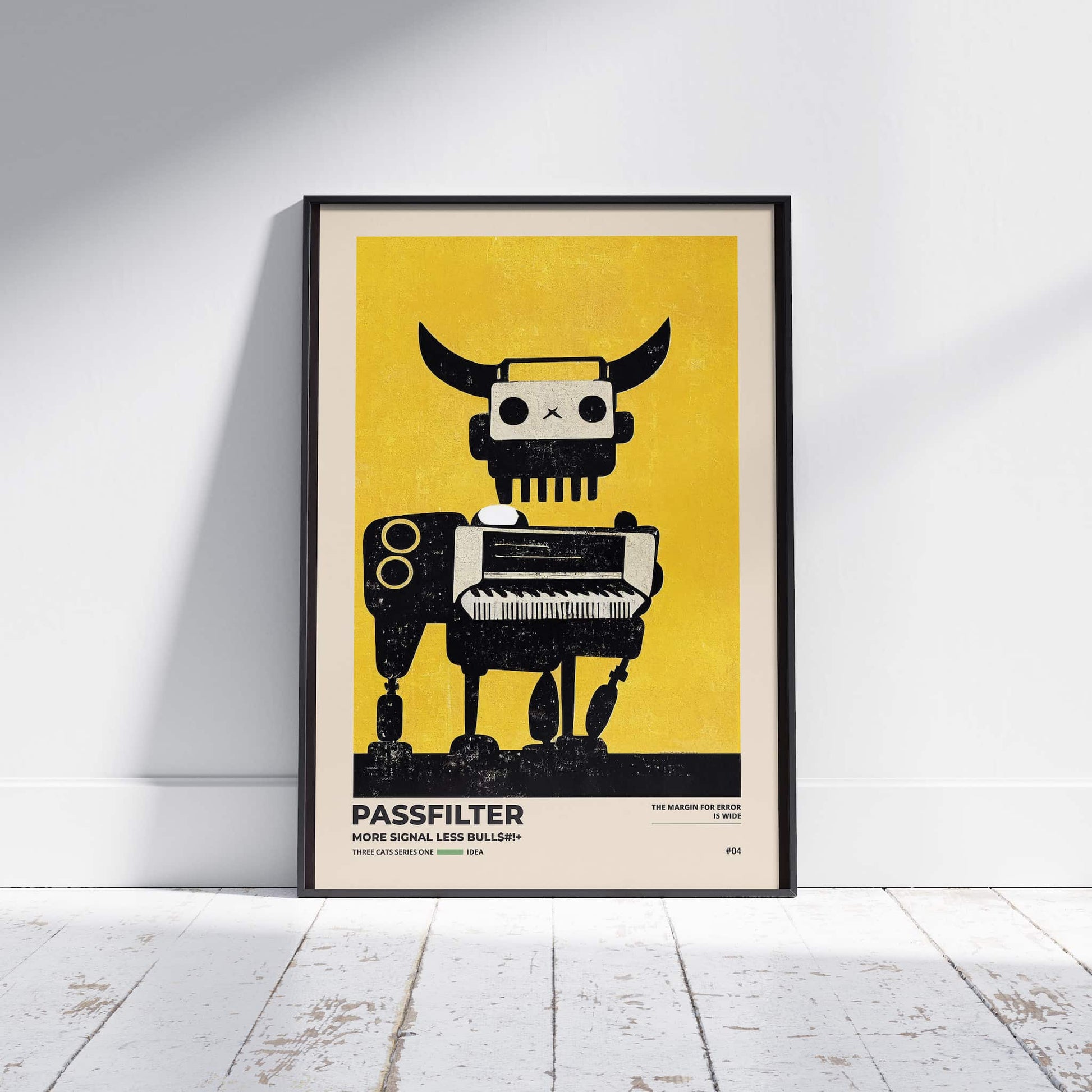 Black framed Passfilter poster sitting on a white wooden floor in a recording studio.