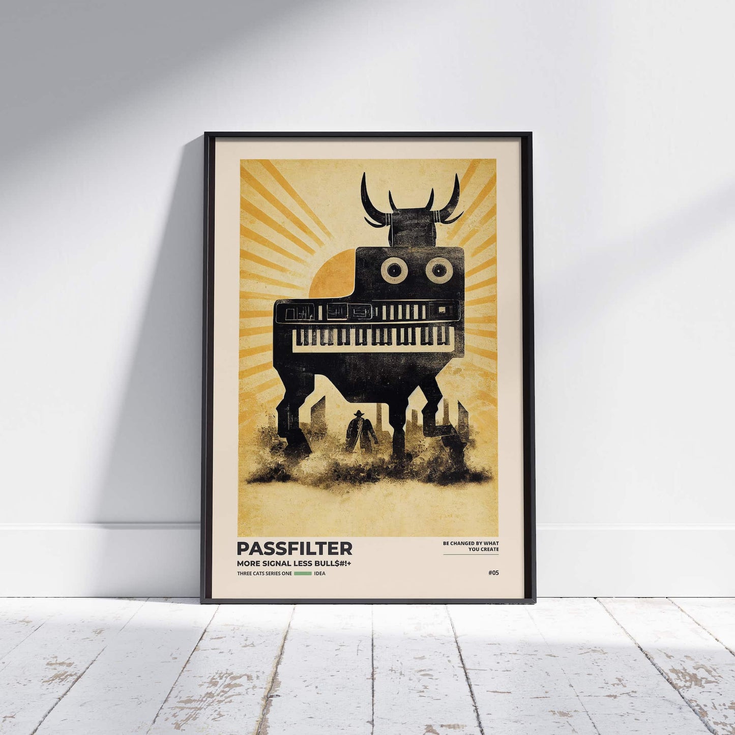 Black framed Passfilter poster sitting on a white wooden floor in a recording studio.