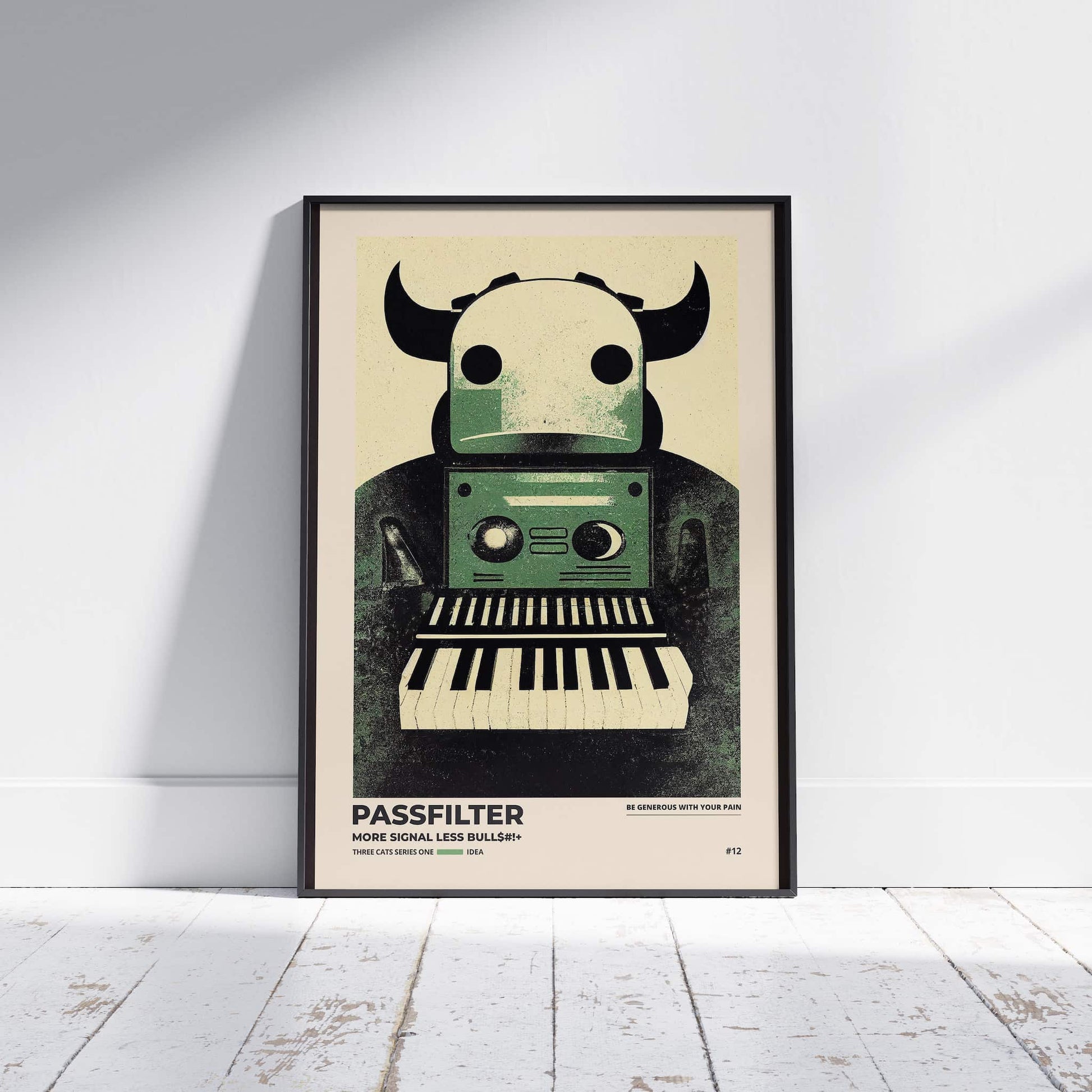 Black framed Passfilter poster sitting on a white wooden floor in a recording studio.
